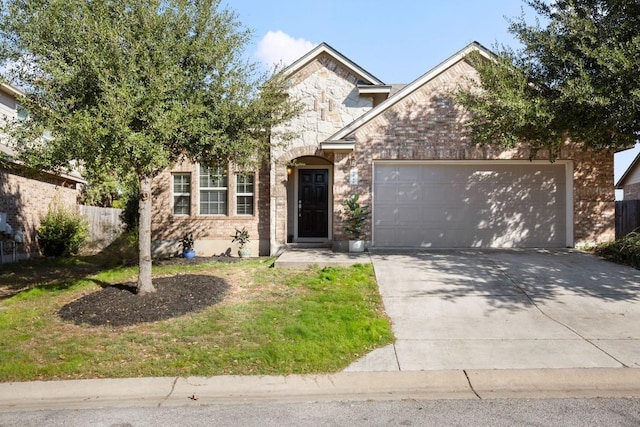 view of front facade featuring a garage and a front lawn