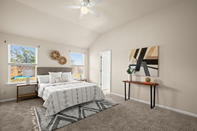 bedroom featuring carpet floors, multiple windows, lofted ceiling, and ceiling fan