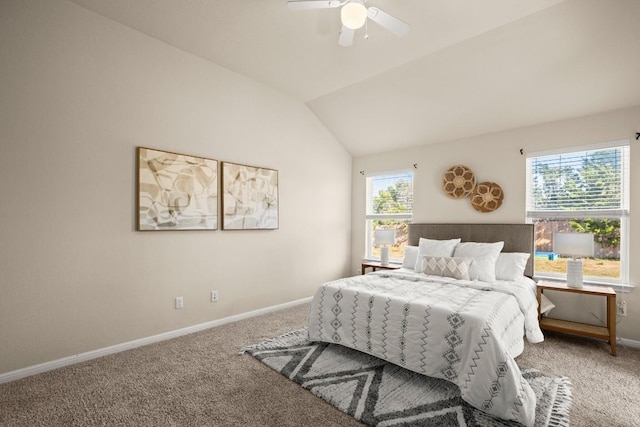 bedroom featuring multiple windows, ceiling fan, carpet, and vaulted ceiling