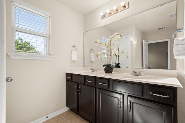 bathroom with tile patterned flooring and vanity