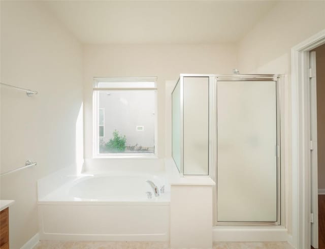 bathroom featuring vanity and plus walk in shower