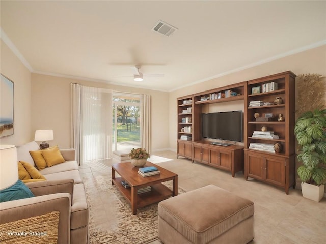 living room featuring ceiling fan and ornamental molding