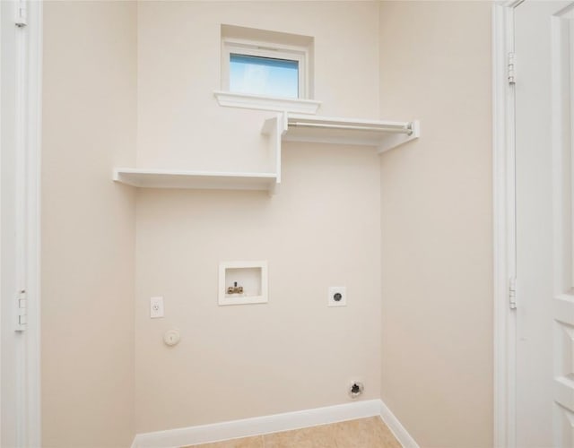 clothes washing area featuring electric dryer hookup, hookup for a gas dryer, light tile patterned floors, and washer hookup