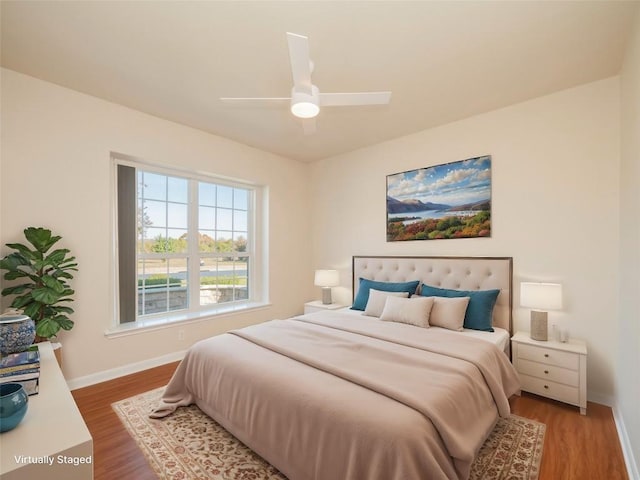 bedroom featuring ceiling fan and wood-type flooring