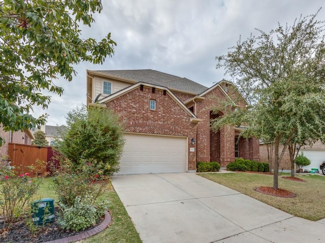 view of front of house featuring a front yard and a garage