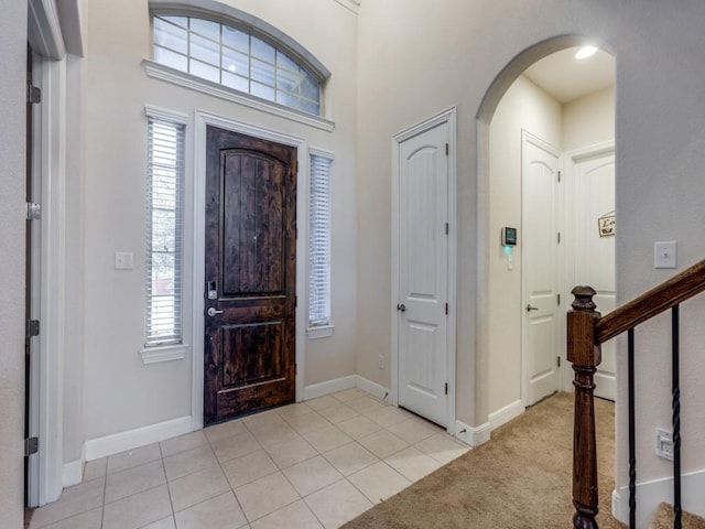 foyer entrance featuring light tile patterned floors