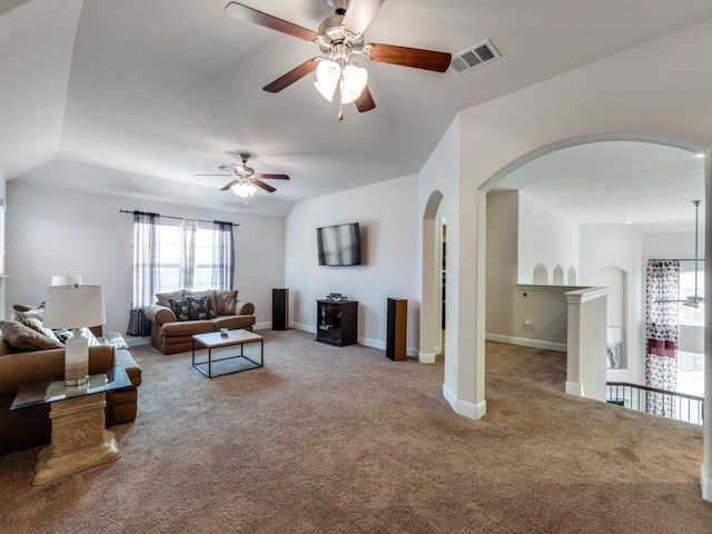 carpeted living room featuring ceiling fan and vaulted ceiling