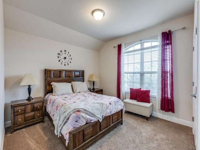 carpeted bedroom featuring vaulted ceiling