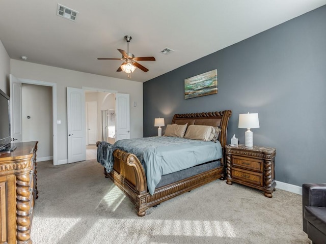 bedroom featuring light carpet and ceiling fan