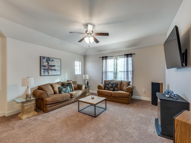 carpeted living room with ceiling fan