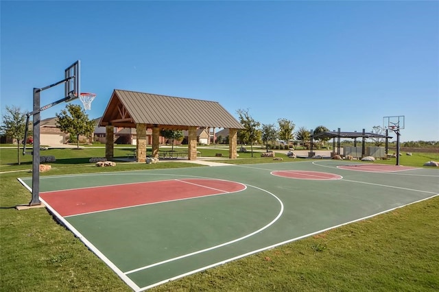 view of sport court featuring a gazebo and a lawn