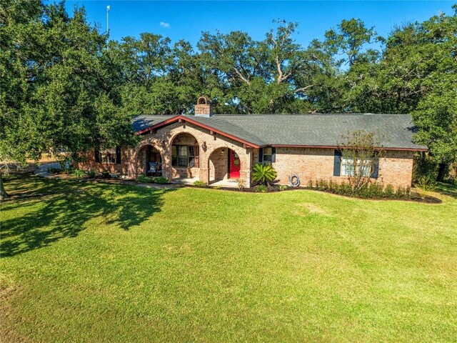 view of front of property with a front lawn