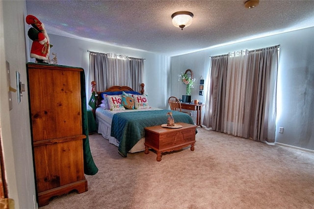 carpeted bedroom with a textured ceiling