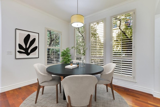 dining area featuring ornamental molding and hardwood / wood-style floors