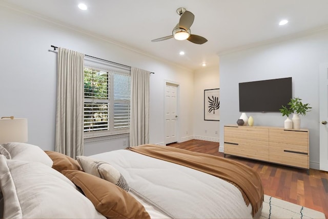 bedroom with ceiling fan, ornamental molding, and dark hardwood / wood-style flooring