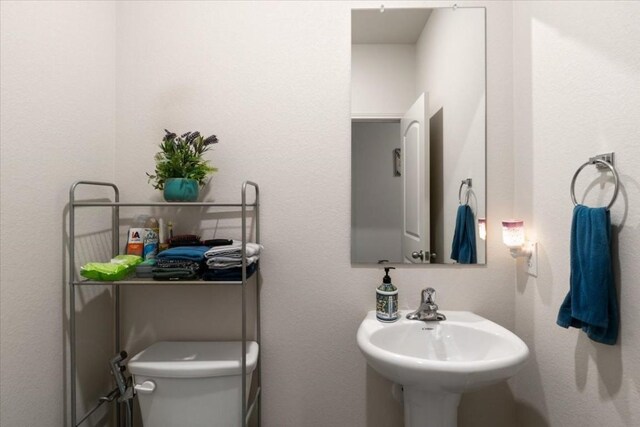 bathroom with sink and toilet