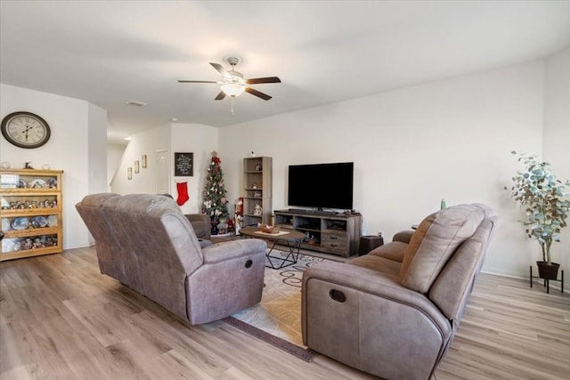 living room featuring ceiling fan and light wood-type flooring