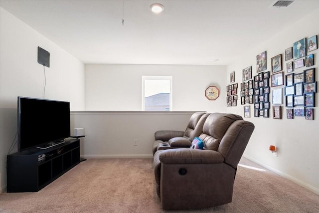 living area with light colored carpet