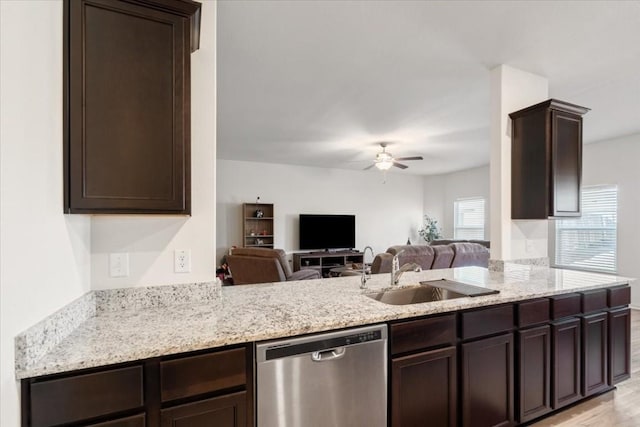 kitchen featuring sink, ceiling fan, dark brown cabinetry, stainless steel dishwasher, and kitchen peninsula