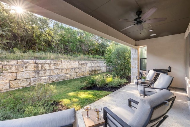 view of patio featuring ceiling fan