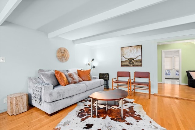 living room featuring beam ceiling, french doors, and wood-type flooring