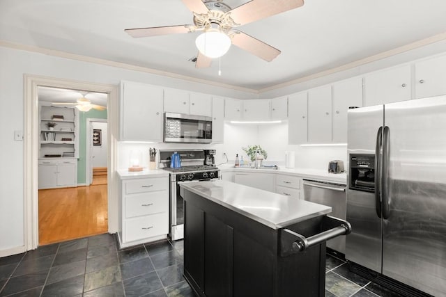 kitchen with white cabinetry, ceiling fan, dark hardwood / wood-style floors, and appliances with stainless steel finishes