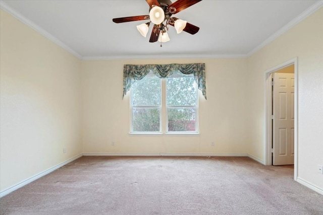 unfurnished room featuring ornamental molding, light carpet, ceiling fan, and baseboards