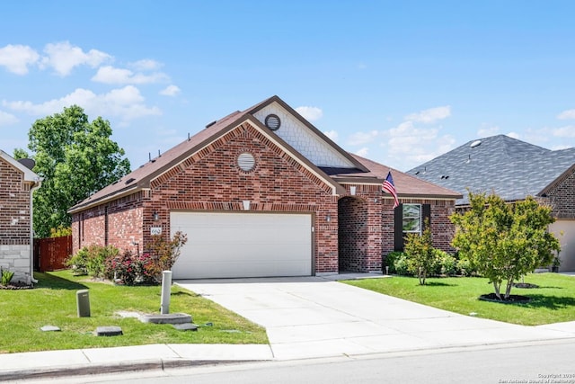 view of front of home featuring a front yard, brick siding, driveway, and an attached garage