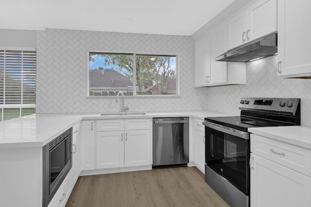 kitchen featuring sink, white cabinets, and stainless steel appliances