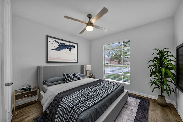 bedroom with ceiling fan and hardwood / wood-style floors