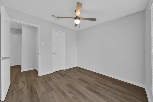 unfurnished bedroom featuring hardwood / wood-style floors and ceiling fan