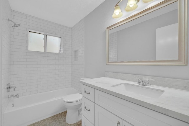 full bathroom featuring vanity, toilet, and tiled shower / bath combo