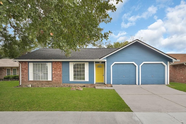 single story home with a front yard and a garage