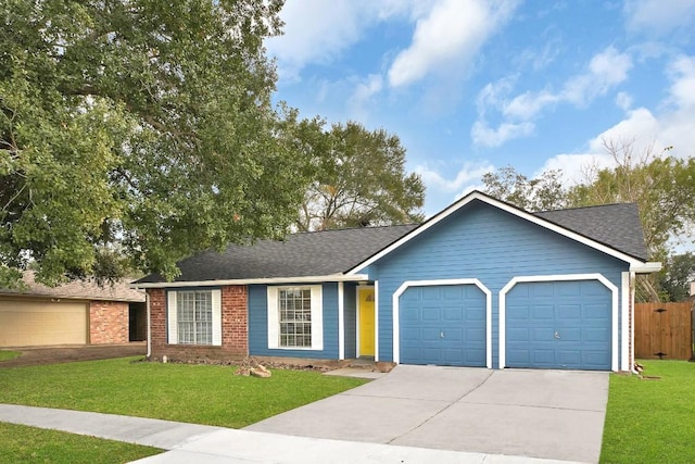 ranch-style home with a front yard and a garage