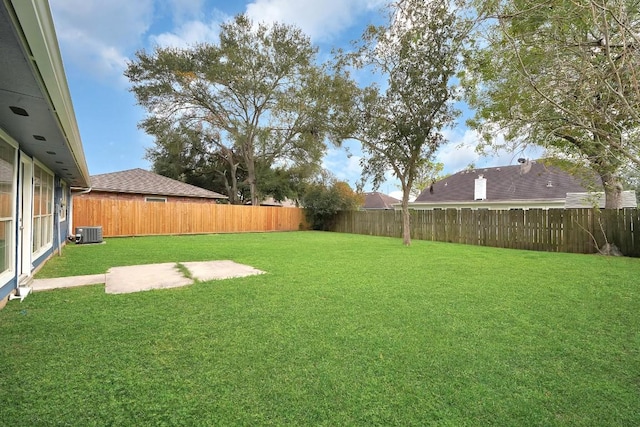 view of yard featuring central AC