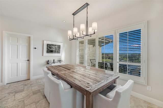 dining room featuring a notable chandelier