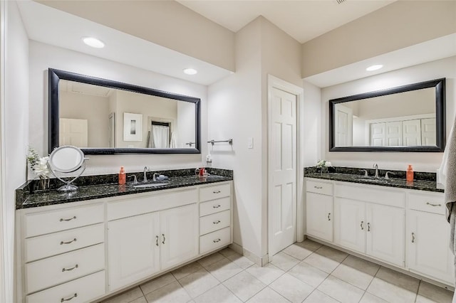 bathroom with tile patterned floors and vanity