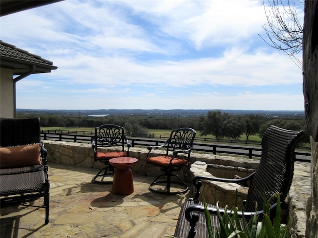 view of patio with a rural view