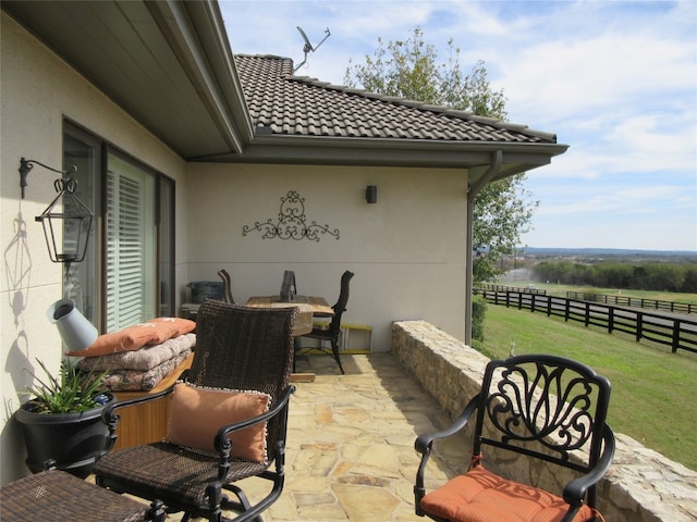 view of patio / terrace with a rural view