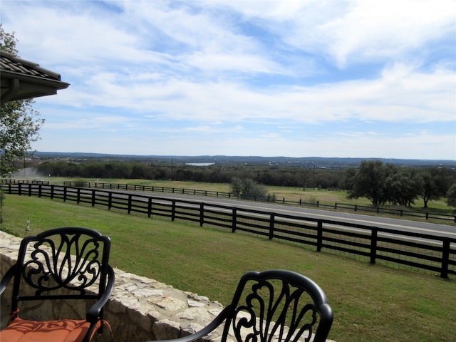 view of yard with a rural view