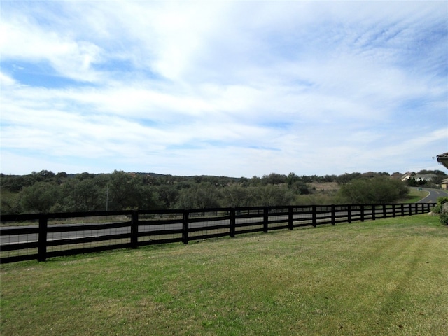 view of yard with a rural view