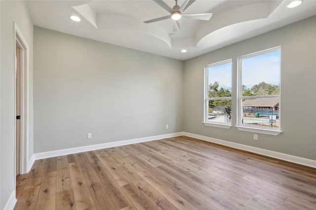 unfurnished room with light wood-type flooring and ceiling fan