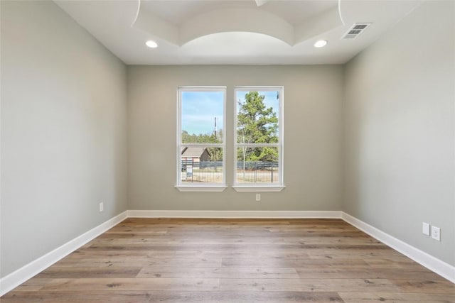 unfurnished room with light hardwood / wood-style flooring