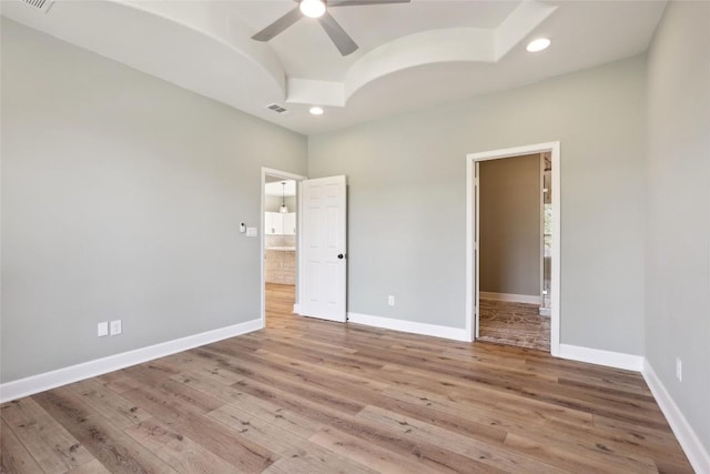 109 Creekside Dr, Bastrop, TX 78602 - unfurnished bedroom with vaulted ceiling, wood finished floors, recessed lighting, baseboards, and connected bathroom