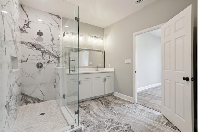 109 Creekside Dr, Bastrop, TX 78602 - bathroom featuring a marble finish shower, vanity, baseboards, and marble finish flooring