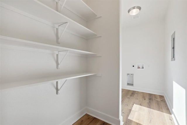 109 Creekside Dr, Bastrop, TX 78602 - washroom with hookup for a washing machine, wood finished floors, and baseboards