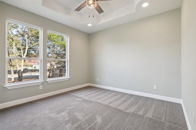 109 Creekside Dr, Bastrop, TX 78602 - carpeted empty room featuring ceiling fan, a raised ceiling, baseboards, and recessed lighting
