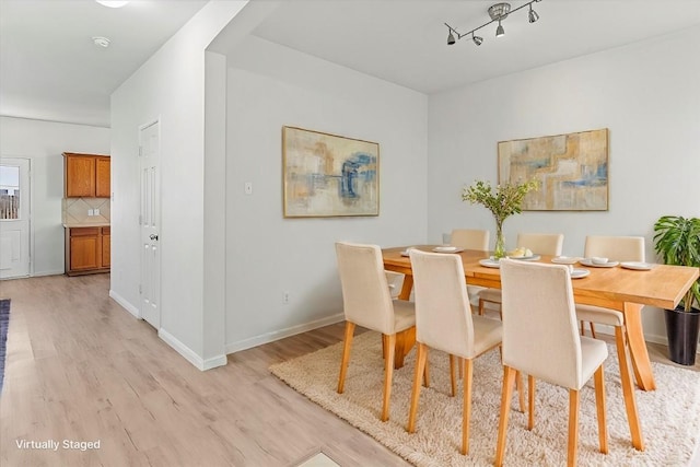 dining area with light hardwood / wood-style flooring