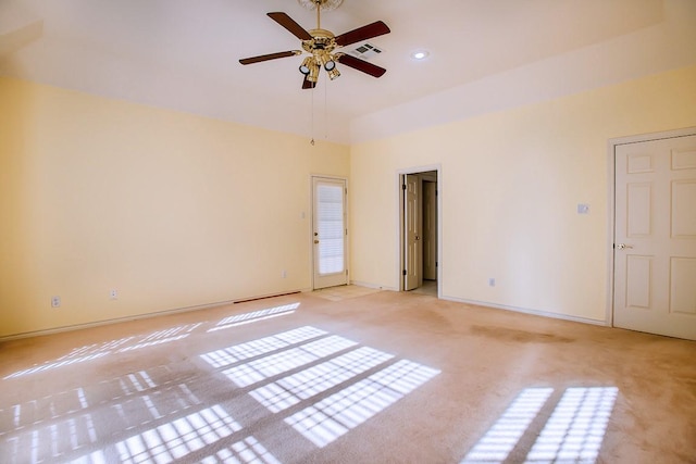 carpeted empty room featuring ceiling fan