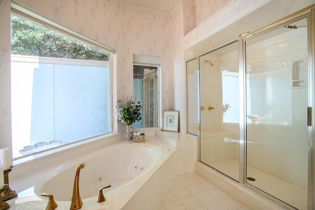 bathroom featuring tile patterned floors and separate shower and tub